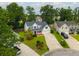 Home with a well-kept lawn, driveway, and mature trees in a suburban neighborhood at 106 Brandy Ct, Summerville, SC 29485
