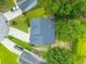 Home featuring a durable roof, surrounded by trees, with a driveway and green lawns at 106 Brandy Ct, Summerville, SC 29485