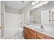 Bright bathroom with white subway tiles in the shower and a wood vanity at 106 Brandy Ct, Summerville, SC 29485