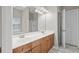 Bathroom features a double sink vanity with wood cabinets and marble style tile floors at 106 Brandy Ct, Summerville, SC 29485