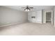 Neutral bedroom with built-in white bookshelves and a ceiling fan for added comfort at 106 Brandy Ct, Summerville, SC 29485