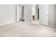 Spacious bedroom with neutral walls and carpet flooring leading to a bathroom and bedroom at 106 Brandy Ct, Summerville, SC 29485
