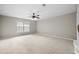 Bedroom features neutral paint, carpet, trim, a ceiling fan, and natural light at 106 Brandy Ct, Summerville, SC 29485