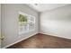 An empty bedroom featuring natural light, neutral paint, wood floors, and classic trim at 106 Brandy Ct, Summerville, SC 29485