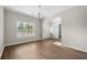 Bright dining room featuring beautiful wood floors, a chandelier, and a large window with natural light at 106 Brandy Ct, Summerville, SC 29485
