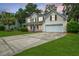 Charming two-story home with a welcoming front porch and a well-maintained lawn at 106 Brandy Ct, Summerville, SC 29485