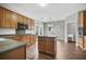 Kitchen with center island, wooden cabinets, stainless steel appliances, and modern lighting at 106 Brandy Ct, Summerville, SC 29485