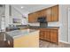 Open kitchen showcasing stainless appliances, spacious countertops, custom wood cabinets, and modern fixtures at 106 Brandy Ct, Summerville, SC 29485