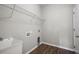 Functional laundry room with a utility sink and convenient wire shelving at 106 Brandy Ct, Summerville, SC 29485