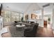 Staged living room boasting hardwood floors, fireplace, tall windows, and stylish decor at 106 Brandy Ct, Summerville, SC 29485