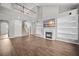 Open living space with high ceilings, fireplace, built-in shelves, and staircase at 106 Brandy Ct, Summerville, SC 29485