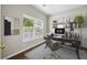 This home office is complete with a modern desk, rolling chair, and well-lit display shelves at 106 Brandy Ct, Summerville, SC 29485