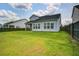 A spacious backyard shows off the house and lawn, great for outdoor activities and entertainment at 111 Medford St, Summerville, SC 29486