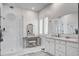 Bright bathroom with glass shower, vanity with double sinks, and elegant white cabinets at 111 Medford St, Summerville, SC 29486