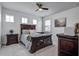 Comfortable bedroom featuring a dark wood bed, nightstands, and carpet floors at 111 Medford St, Summerville, SC 29486