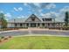 Community clubhouse with a modern farmhouse design, featuring a landscaped entrance and ample parking at 111 Medford St, Summerville, SC 29486
