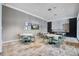 Bright common area featuring tables, chairs, and a modern design for social gatherings at 111 Medford St, Summerville, SC 29486