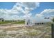Community garden with a greenhouse, crops, and neatly organized plots in a charming neighborhood setting at 111 Medford St, Summerville, SC 29486