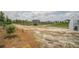 View of community garden with crops, a greenhouse, and a small tractor, showcasing the farm-to-table lifestyle at 111 Medford St, Summerville, SC 29486