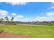 Beautiful community lake view surrounded by lush green lawn and manicured landscaping at 111 Medford St, Summerville, SC 29486