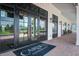 Elegant clubhouse entrance with glass doors, brick walkway, and a welcoming mat for a stylish community space at 111 Medford St, Summerville, SC 29486