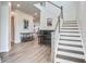 Elegant foyer with hardwood floors, a staircase, and stylish decor leading to the rest of the home at 111 Medford St, Summerville, SC 29486