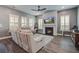 Cozy living room features a fireplace, a ceiling fan, and comfortable seating arrangements at 111 Medford St, Summerville, SC 29486