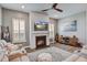 Comfortable living room with a fireplace, a ceiling fan, and cozy seating that is perfect for relaxation at 111 Medford St, Summerville, SC 29486