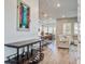 Open-concept living space with hardwood floors, a wine cart, and views into kitchen and seating areas at 111 Medford St, Summerville, SC 29486