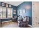 Inviting home office space with two leather chairs, natural light, and stylish blue walls at 111 Medford St, Summerville, SC 29486