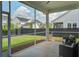 Relaxing screened porch with comfortable seating overlooking a well-maintained backyard and neighboring homes at 111 Medford St, Summerville, SC 29486
