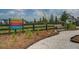 Community You-Pick garden offering fresh produce, featuring a charming sign and bench in a serene setting at 111 Medford St, Summerville, SC 29486