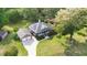 Aerial view of a well-maintained home, large yard, and detached garage in a lush, green neighborhood at 1119 Bruton Blvd, Moncks Corner, SC 29461