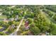 Aerial view of the property nestled in a neighborhood near a golf course and mature trees at 1119 Bruton Blvd, Moncks Corner, SC 29461