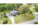 Aerial view of a brick home featuring mature trees and a long driveway at 1119 Bruton Blvd, Moncks Corner, SC 29461