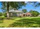 Spacious backyard with mature trees, offering shade and privacy for outdoor enjoyment at 1119 Bruton Blvd, Moncks Corner, SC 29461