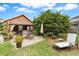 Landscaped backyard featuring outdoor seating, hot tub, and lounge chair at 1119 Bruton Blvd, Moncks Corner, SC 29461