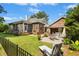 Expansive backyard featuring a patio, screened-in porch, and beautifully landscaped lawn at 1119 Bruton Blvd, Moncks Corner, SC 29461