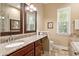Bathroom features granite countertops, wood cabinets, and framed mirrors at 1119 Bruton Blvd, Moncks Corner, SC 29461