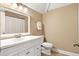 Bathroom featuring white vanity, framed mirror and neutral paint at 1119 Bruton Blvd, Moncks Corner, SC 29461