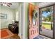 Inviting entryway reveals a glimpse into a living room with a leather sofa at 1119 Bruton Blvd, Moncks Corner, SC 29461