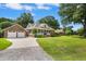 Charming brick home featuring a two-car garage, a front porch, and a well-manicured lawn at 1119 Bruton Blvd, Moncks Corner, SC 29461