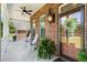 Inviting front porch with brick columns, rocking chairs, and a ceiling fan for relaxing at 1119 Bruton Blvd, Moncks Corner, SC 29461