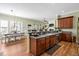 Open kitchen featuring wood cabinets and flooring, complemented by a dining area at 1119 Bruton Blvd, Moncks Corner, SC 29461