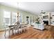 Open-concept living and dining area with hardwood floors and plenty of natural light at 1119 Bruton Blvd, Moncks Corner, SC 29461