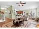 Open-concept living space with a fireplace, built-in shelves, and a modern kitchen at 1119 Bruton Blvd, Moncks Corner, SC 29461
