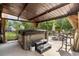 Covered patio area with outdoor hot tub and furniture at 1119 Bruton Blvd, Moncks Corner, SC 29461