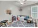 Bedroom with rug features a small bed, toys, ceiling fan, and natural light at 119 White Picket Ln, Summerville, SC 29483