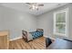 Cozy bedroom features a small bed, wood-look floors, neutral walls, and a ceiling fan at 119 White Picket Ln, Summerville, SC 29483