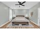 Calm bedroom features a ceiling fan, matching nightstands, light walls and patterned rug at 119 White Picket Ln, Summerville, SC 29483
